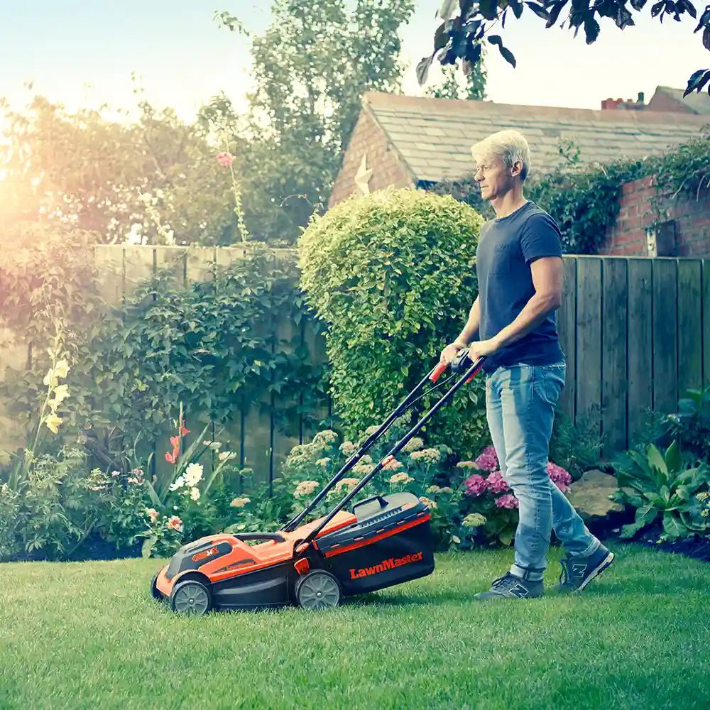 LawnMaster_Cordless_Lawn_Mower_MX_24v_34cm_CLMF2434G-1_Hero_In_Use